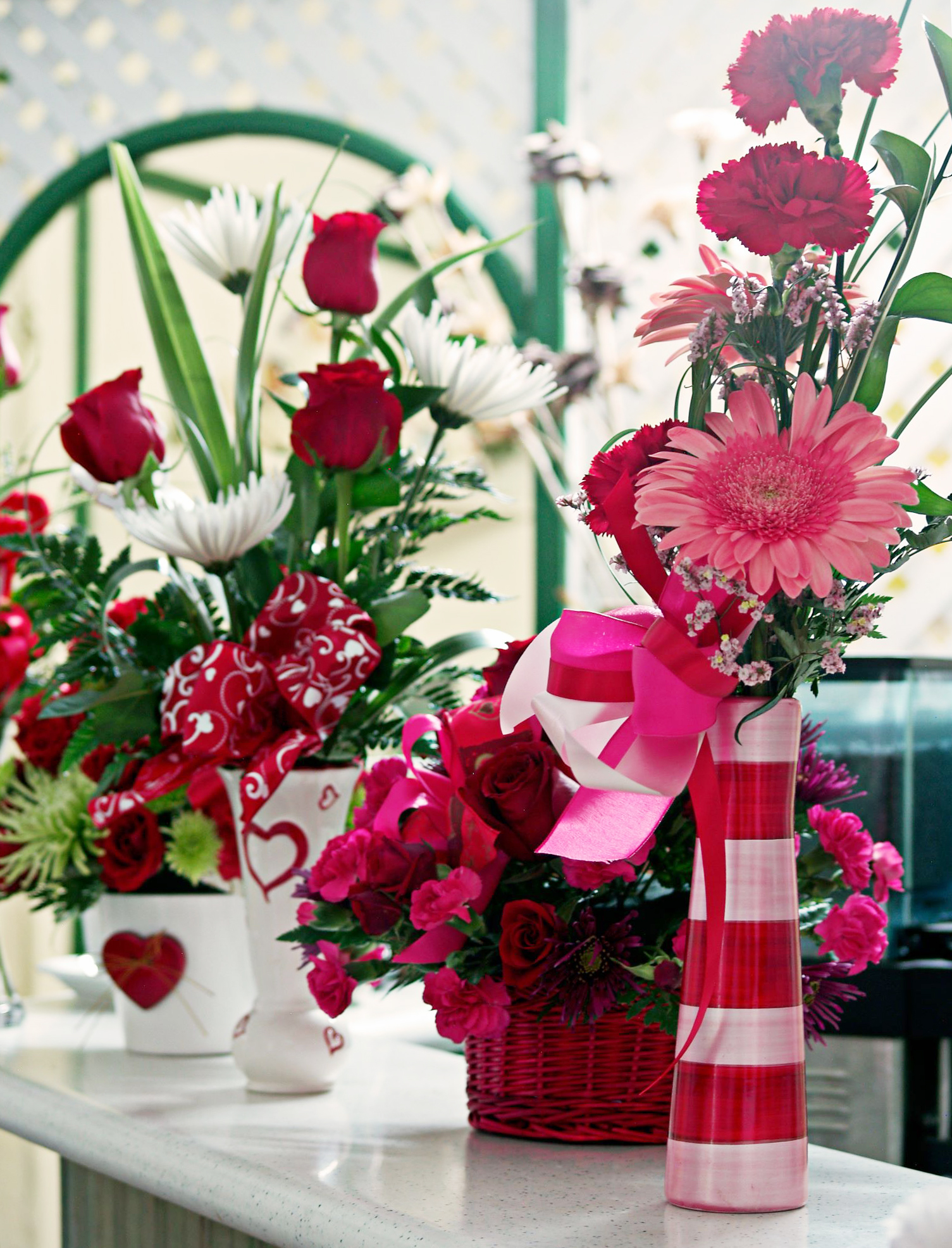 Valentine’s Day flower arrangements with red roses and pink blooms created by Victoria Florist in Barbados.